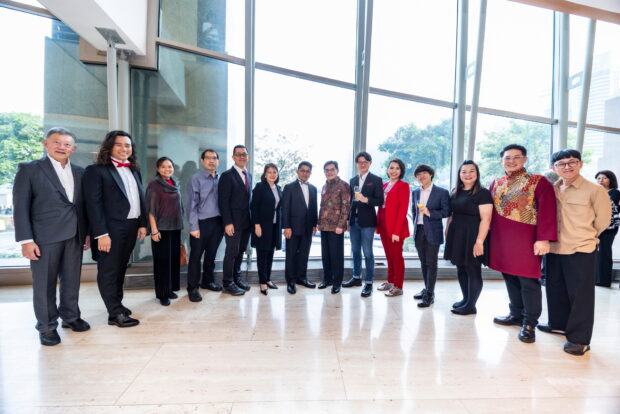 DPM Heng (middle) with performers and composers of the concert.