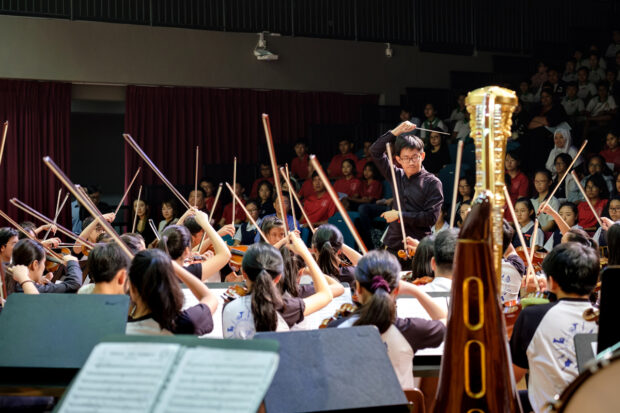 Associate Conductor Lin Juan and the SNYO