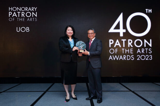 Ms Lilian Chong, Executive Director and Head of Group Brand and CSR, Group Strategic Communications and Brand, UOB, receiving the Honorary Patron of the Arts and Distinguished Patron of the Arts (Corporate). (Photo: National Arts Council)