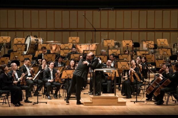 Violinist He Ziyu and Maestro Choo Hoey at the end of the Mozart Violin Concert No. 4