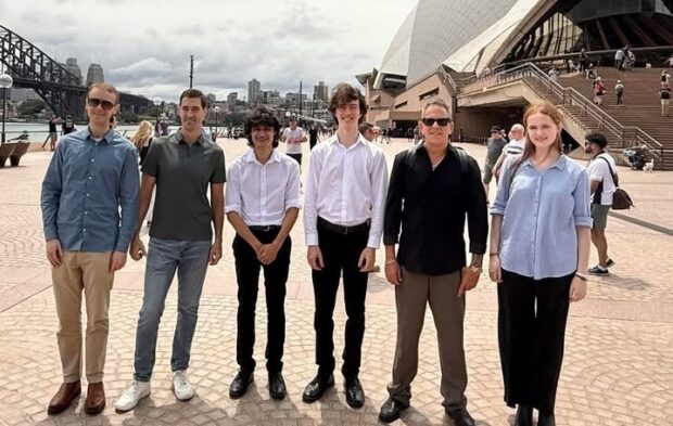 SSO Principal Trumpet Jon Dante, Principal Horn Austin Larson and Associate Principal Trombone Damian Patti with members of the Sydney Youth Orchestra.