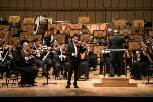 Violinist He Ziyu with the SSO led by Maestro Choo Hoey