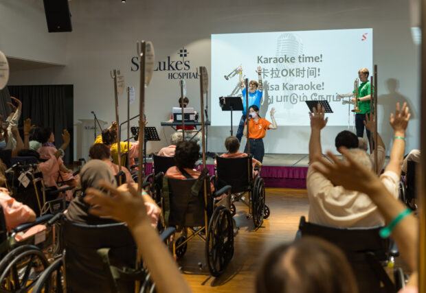 Musicians engaging with residents at St Luke’s Hospital through karaoke time