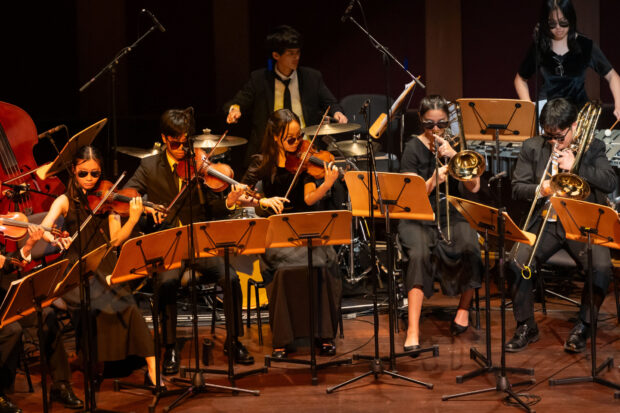 SNYO Jazz Ensemble performing in shades.