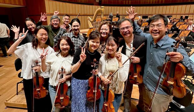 TMSO violinist Sayaka Kagei (front row, far right) with the SSO first violin section in Singapore (October 2025).