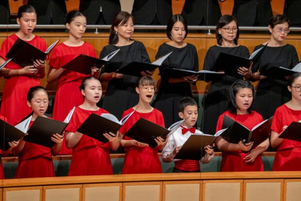 SSC singing Between Two Worlds: Three Songs for Voices and Orchestra arranged by Chok Kerong.