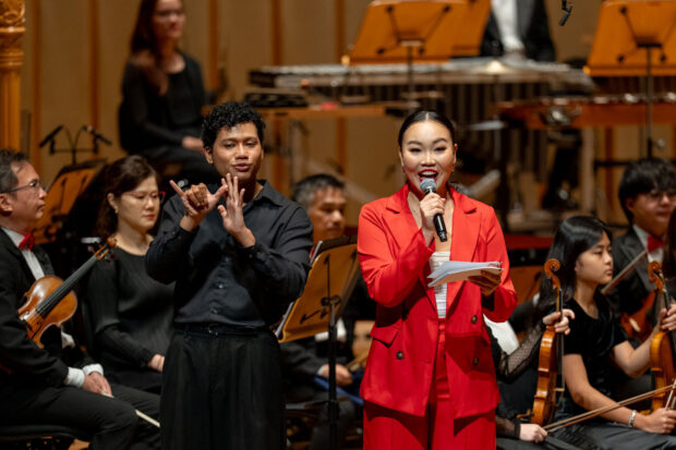 Host Priscilla Fong with sign language interpreter Azzam Akbar.