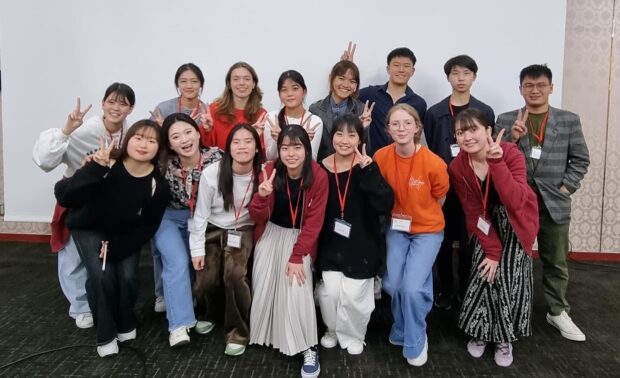 SNYO violinists Chloe (front row, third from left) and Shi Eun (back row, fourth from the left) with fellow participants at the 40th Toyota Youth Orchestra Camp (2024) in Matsue City, Shimane, Japan.