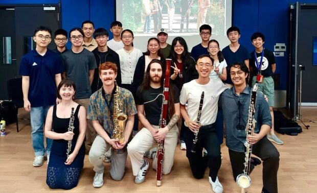 SNYO members with guest artists nonesuch.reedquintet in 2025, who conducted a workshop on rehearsal strategies and ensemble playing.