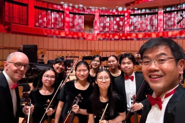 With members of the SNYO at SSO's National Day Concert 2026