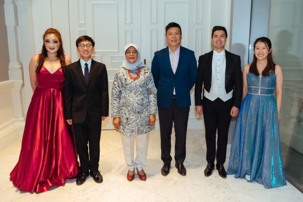 With 2022’s President’s young performers in August 2022. (L-R: Evangeline Ng, Quek Jun Rui, President Halimah Yacob, SSO Associate Conductor Rodolfo Barráez, Pualina Lim)
