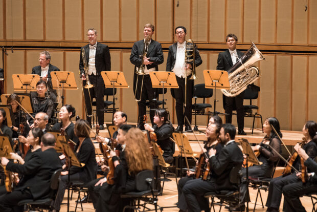 Tomoki (rightmost) at the Hans Graf & Alexei Volodin concert, a familiar presence within the brass section.
