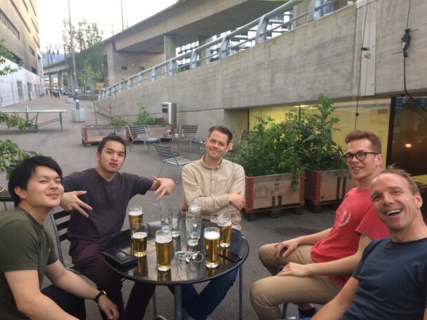 Tomoki with his teacher and classmates during university days.