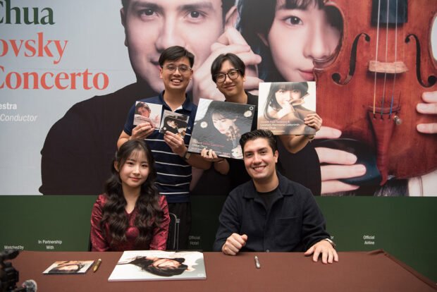 Chloe Chua autograph session with fans, featuring CDs and vinyl records from her discography after the Singapore concert.